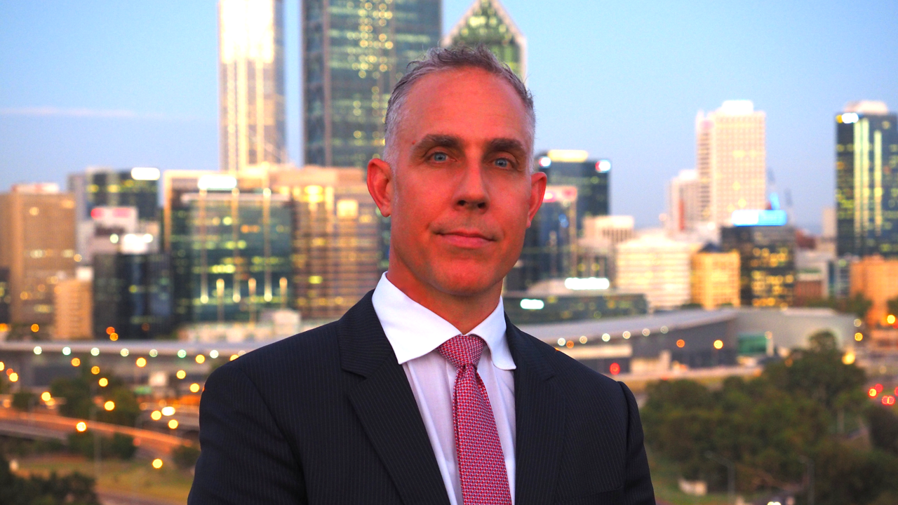 Leon Gerard Vandenberg in front of a city skyline