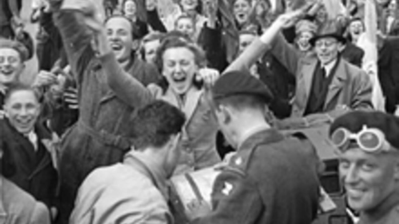 Dutch civilians and Canadian Army troops celebrating the Liberation