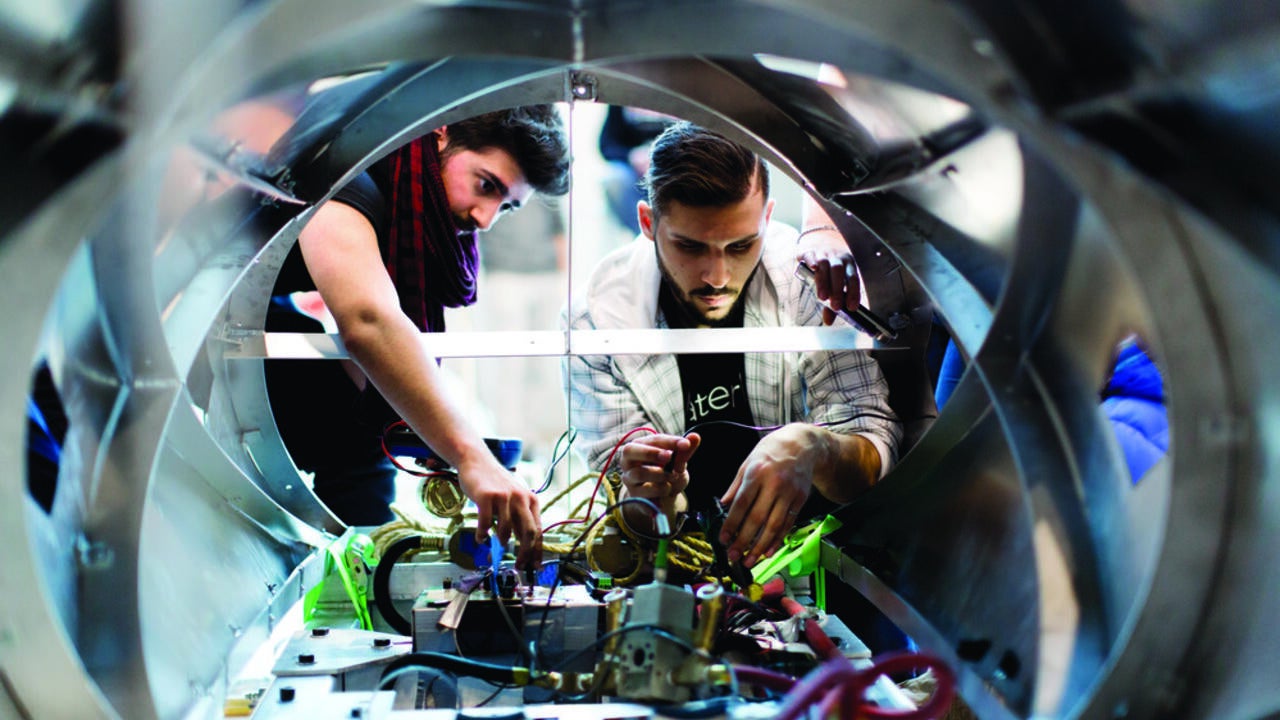 Two students working on the levitations system for the hyperloop pod 