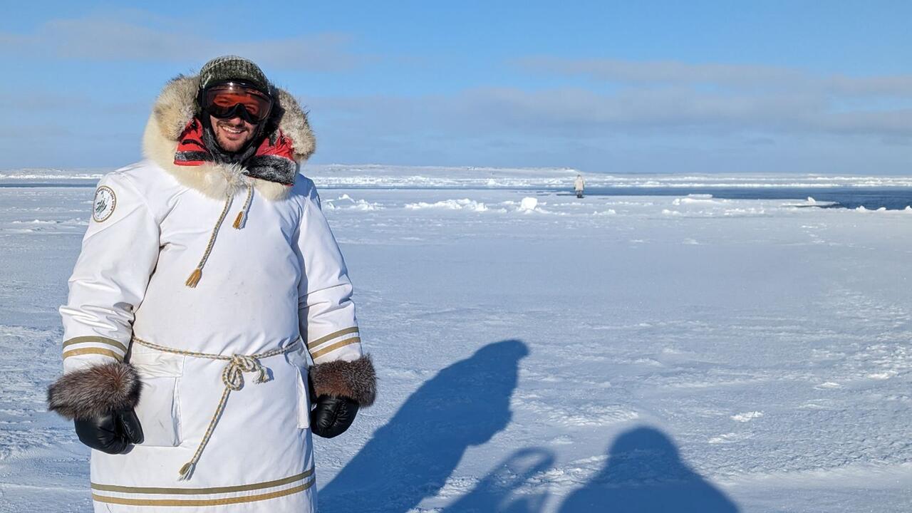 Man standing on ice pack in Nunavut 