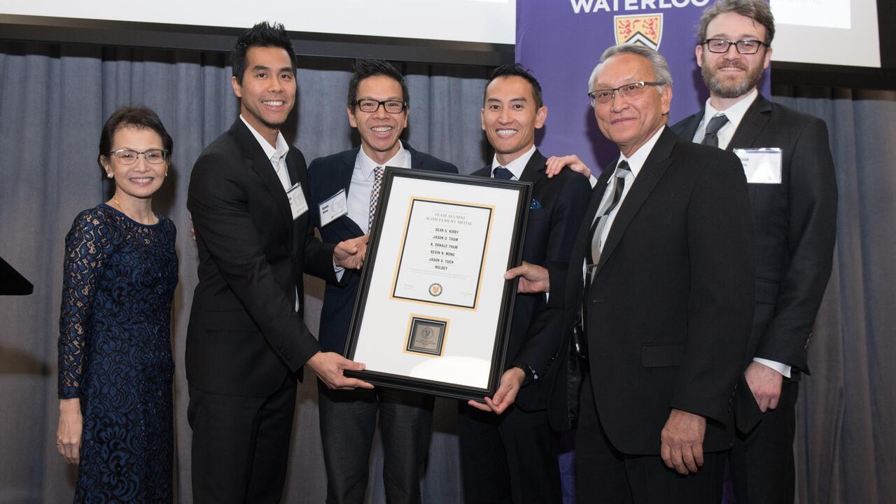 The Nulogy team accept their award with Dean Pearl Sullivan