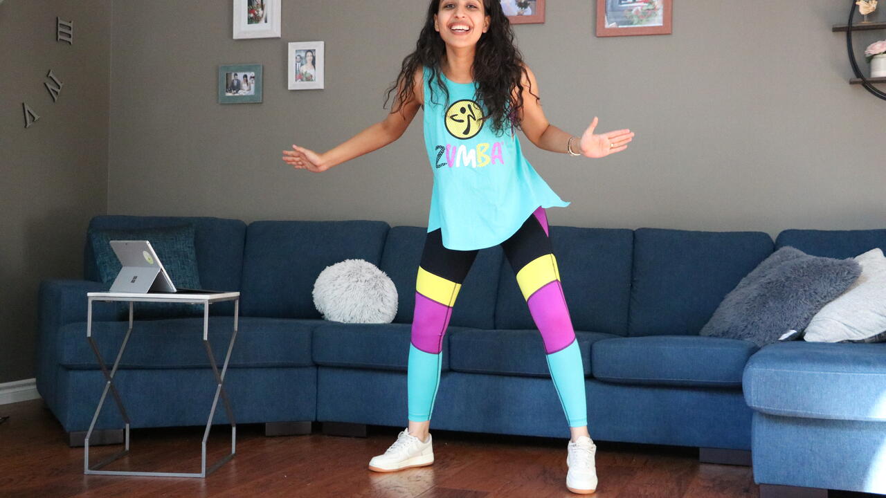 Aida teaches a Zumba class from her living room