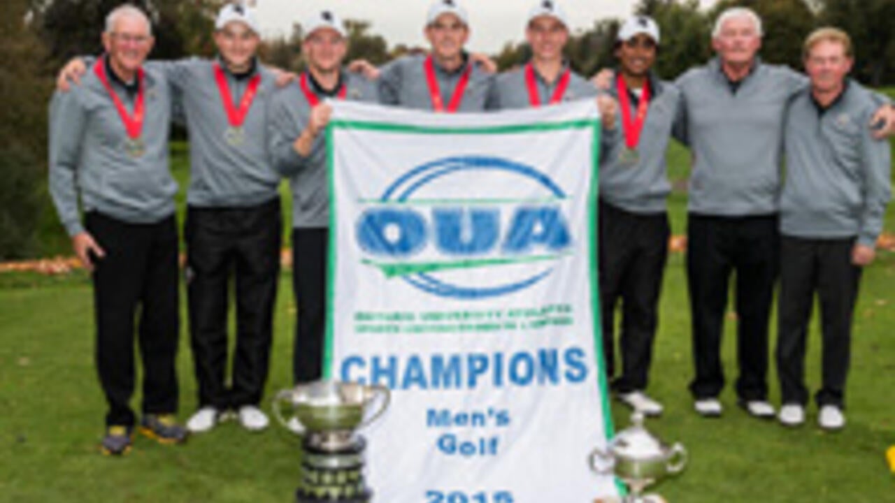 Men's golf team with their trophy