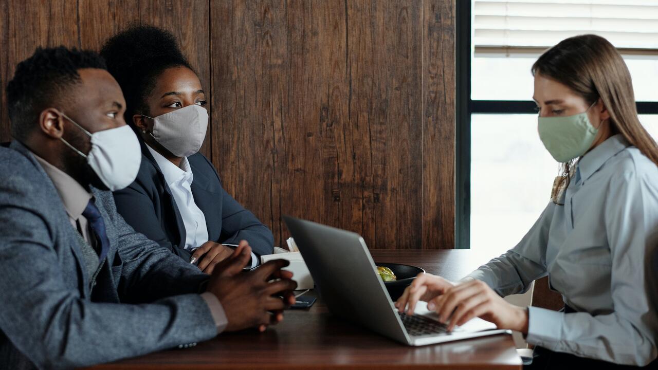 Workers meet with masks on