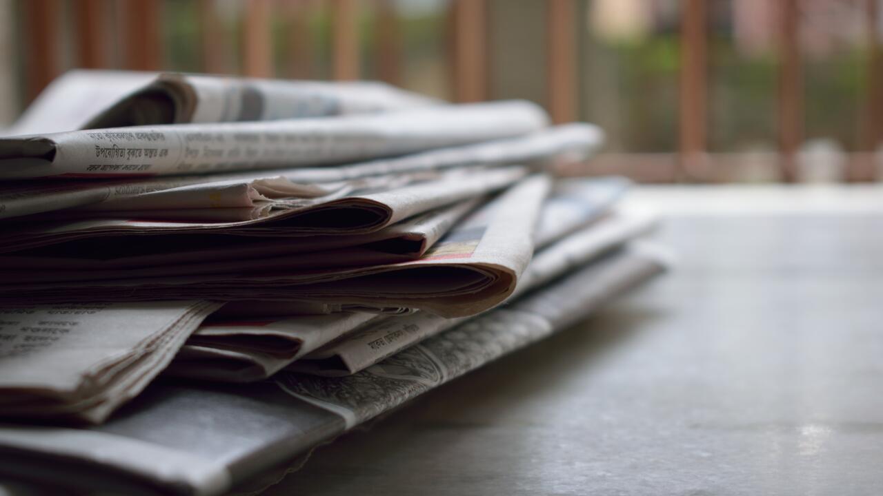 Stacked newspapers