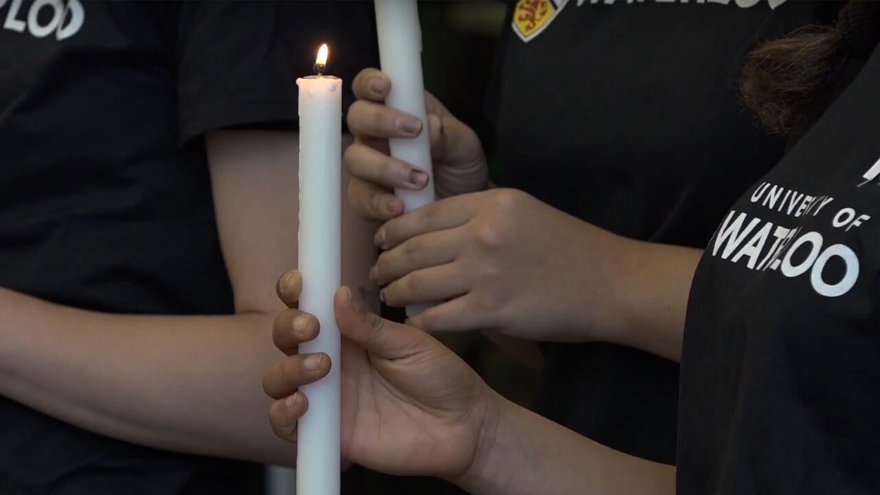 student holding candle