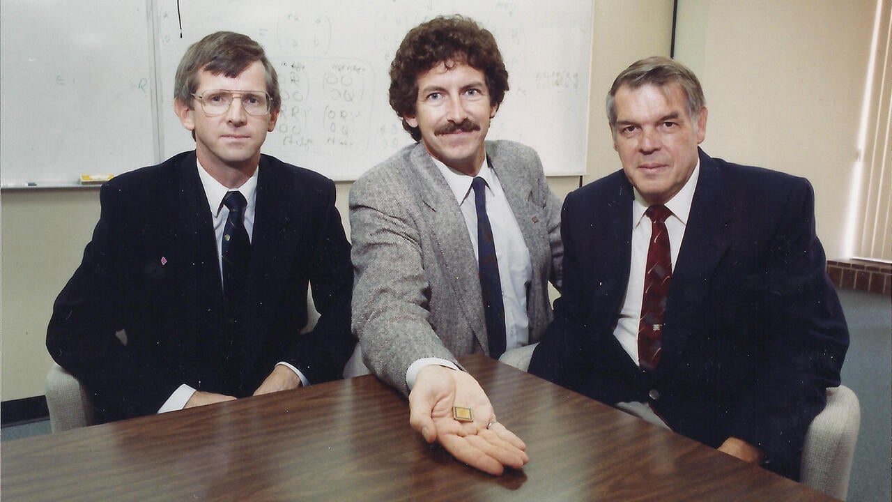 Scott, Gord and Ron sitting at a table