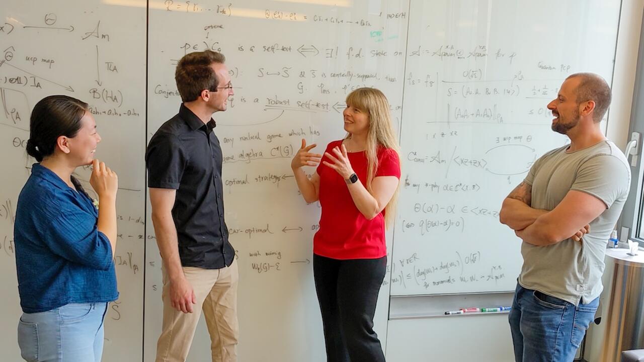 Dr. Christine Muschik with researchers of the qudit quantum computer project