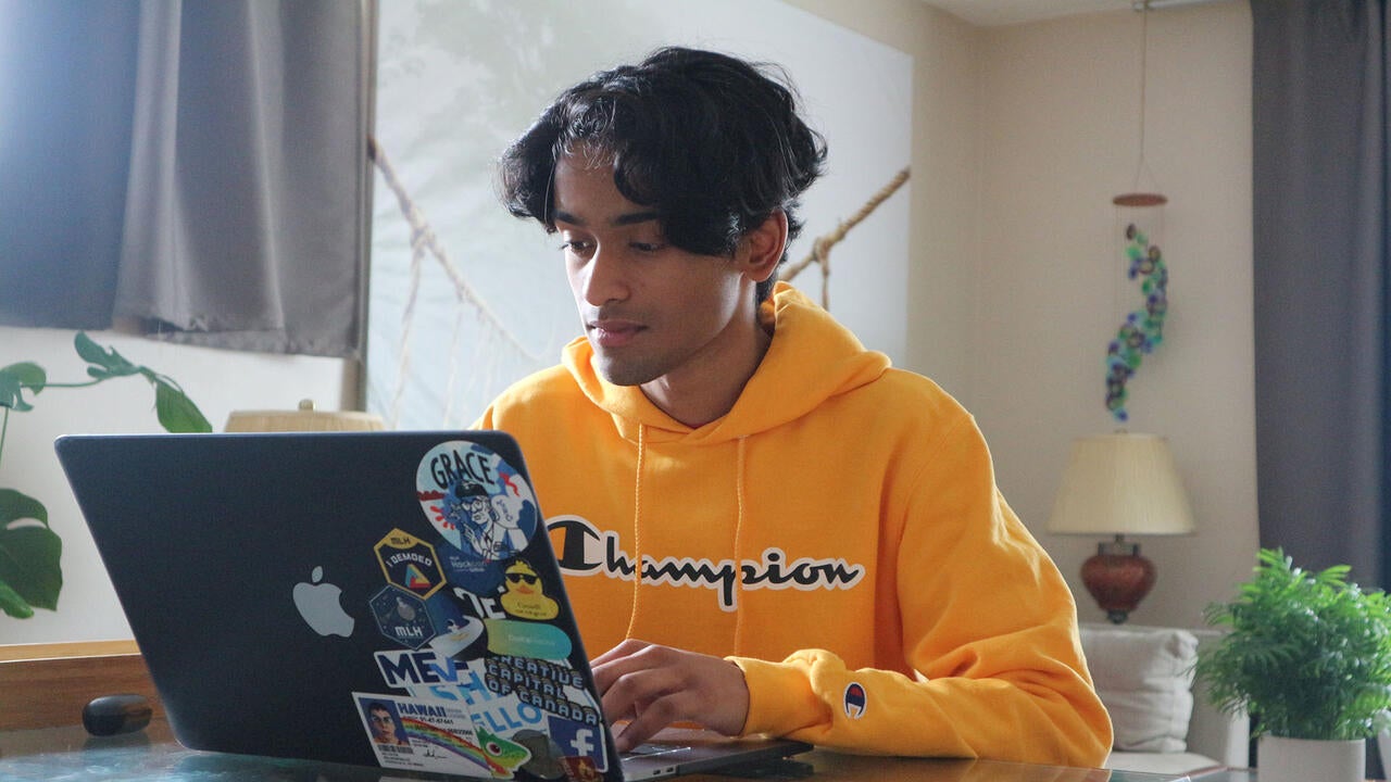 Student at desk on computer