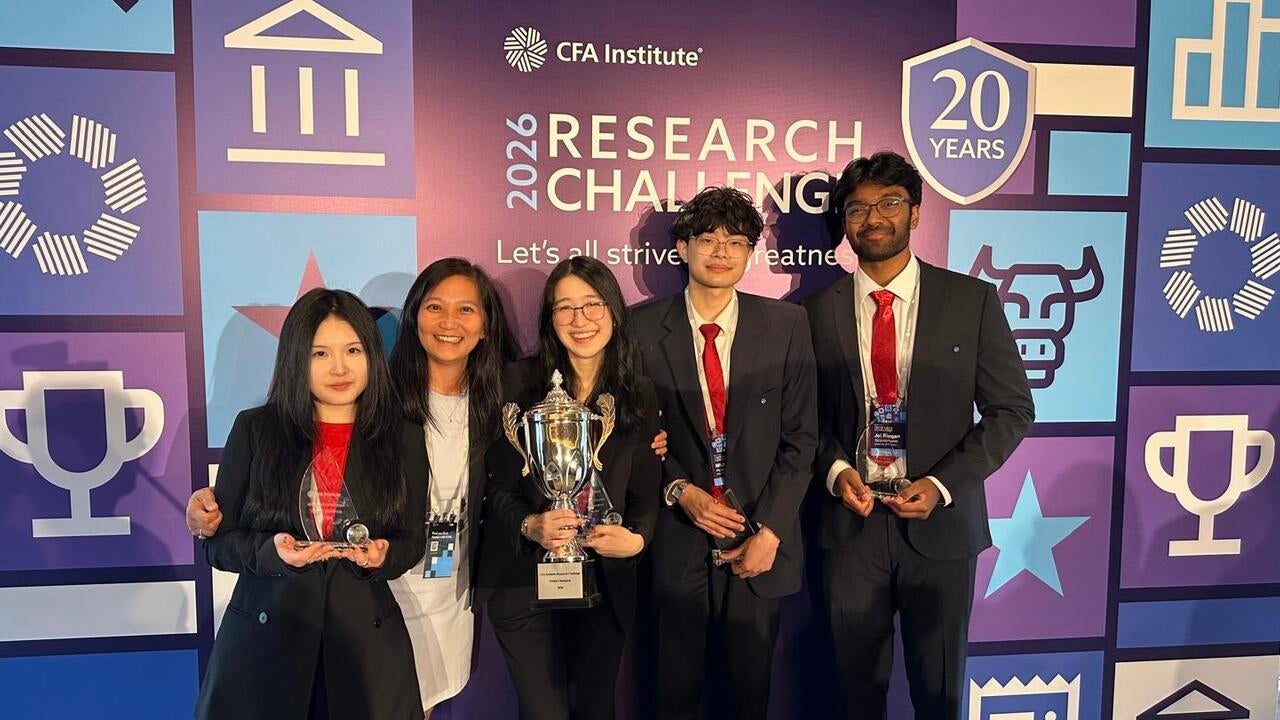 five young people holding trophies in front of CFA competition backdrop 