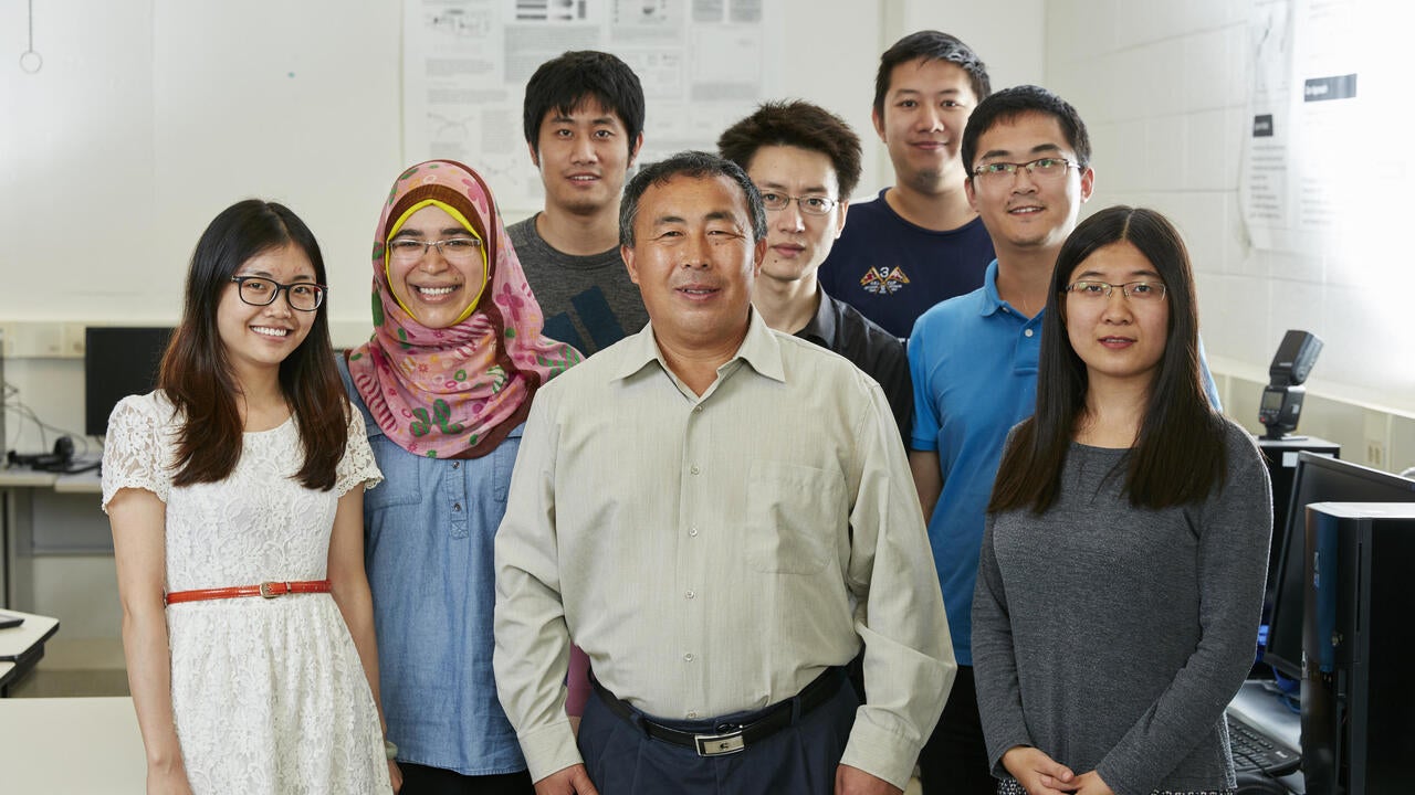 Xuemin (Sherman) Shen posing with graduate students