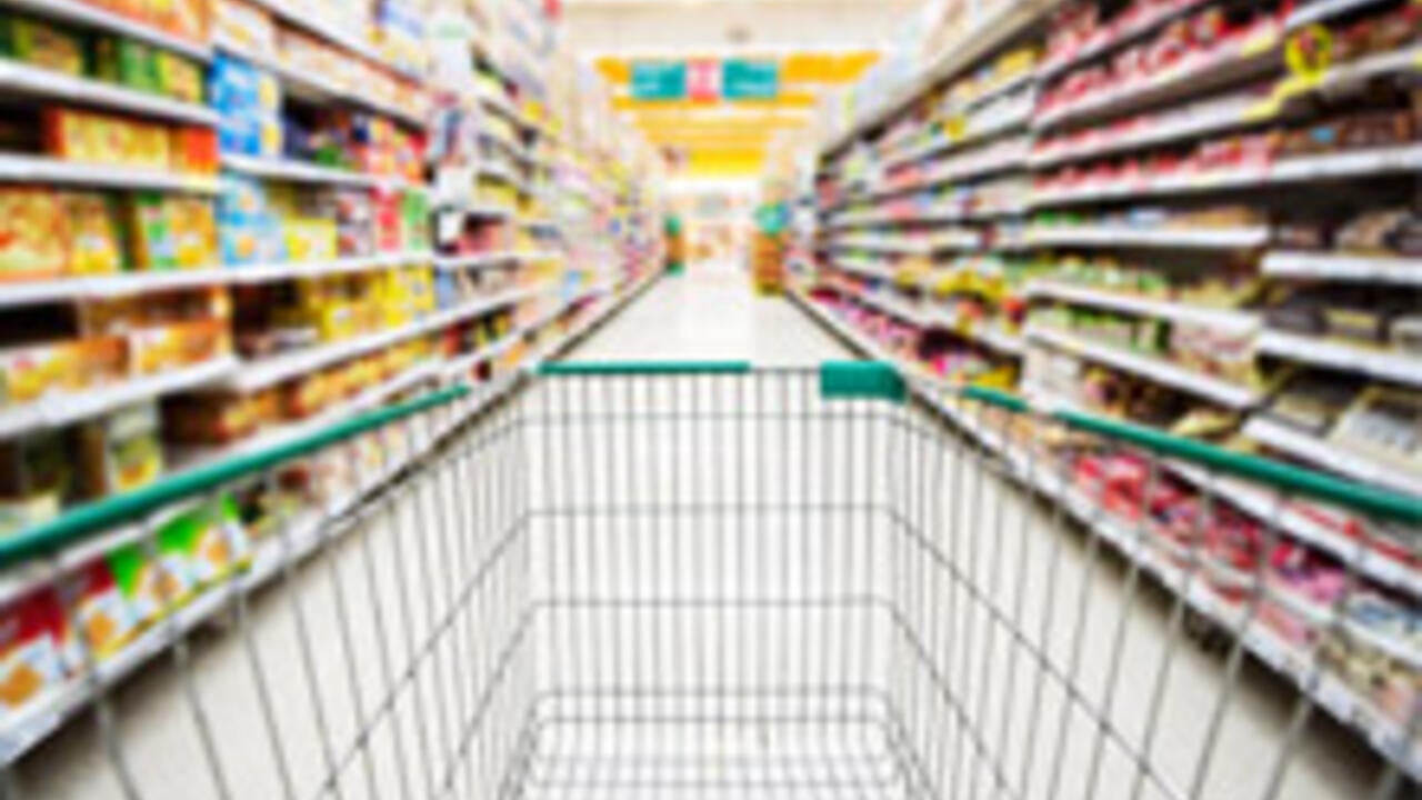 Shopping cart in grocery aisle