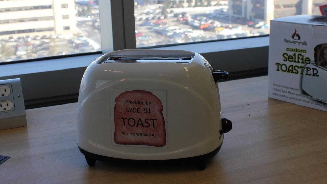 practical joke item: custom selfie toaster on a table with sticker 