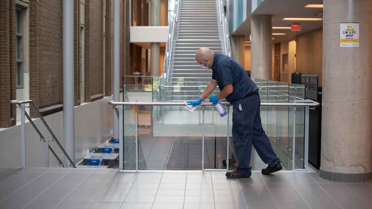 Maintenance worker cleaning campus