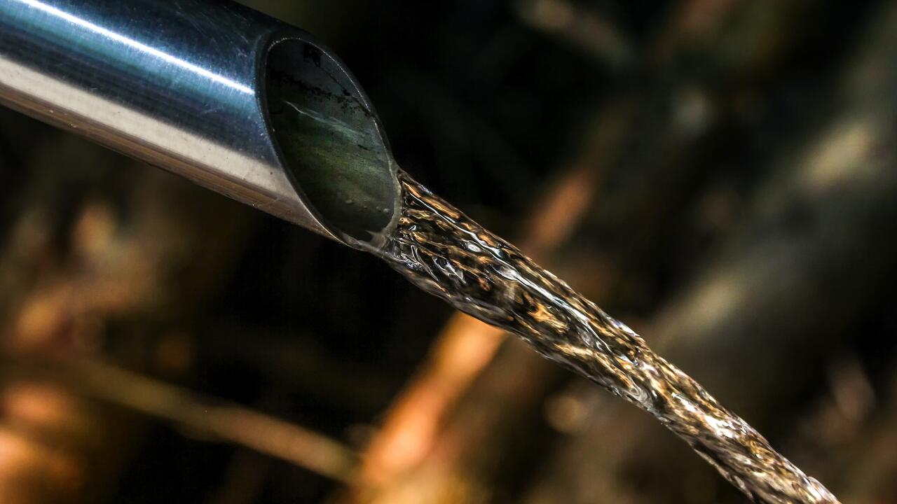 Image of water pipe with water coming out of it