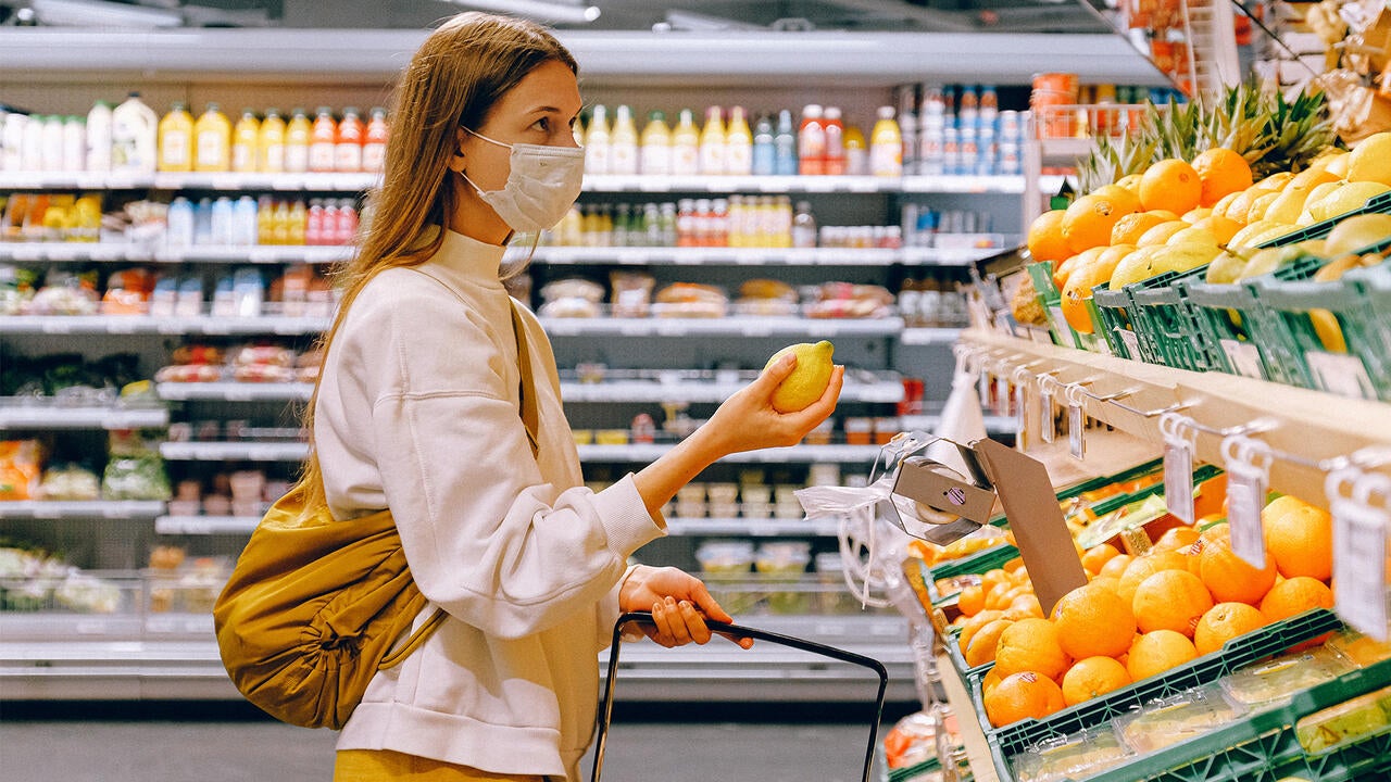 Woman wearing mask grocery shopping