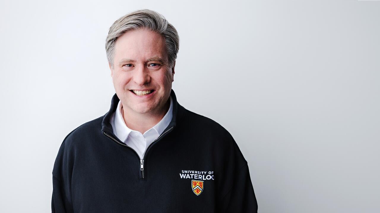 Dr. Bill Rosehart wearing a UWaterloo polo shirt