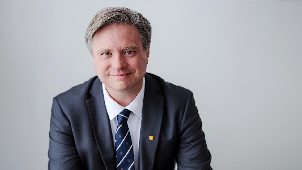 Dr. Bill Rosehart sitting down