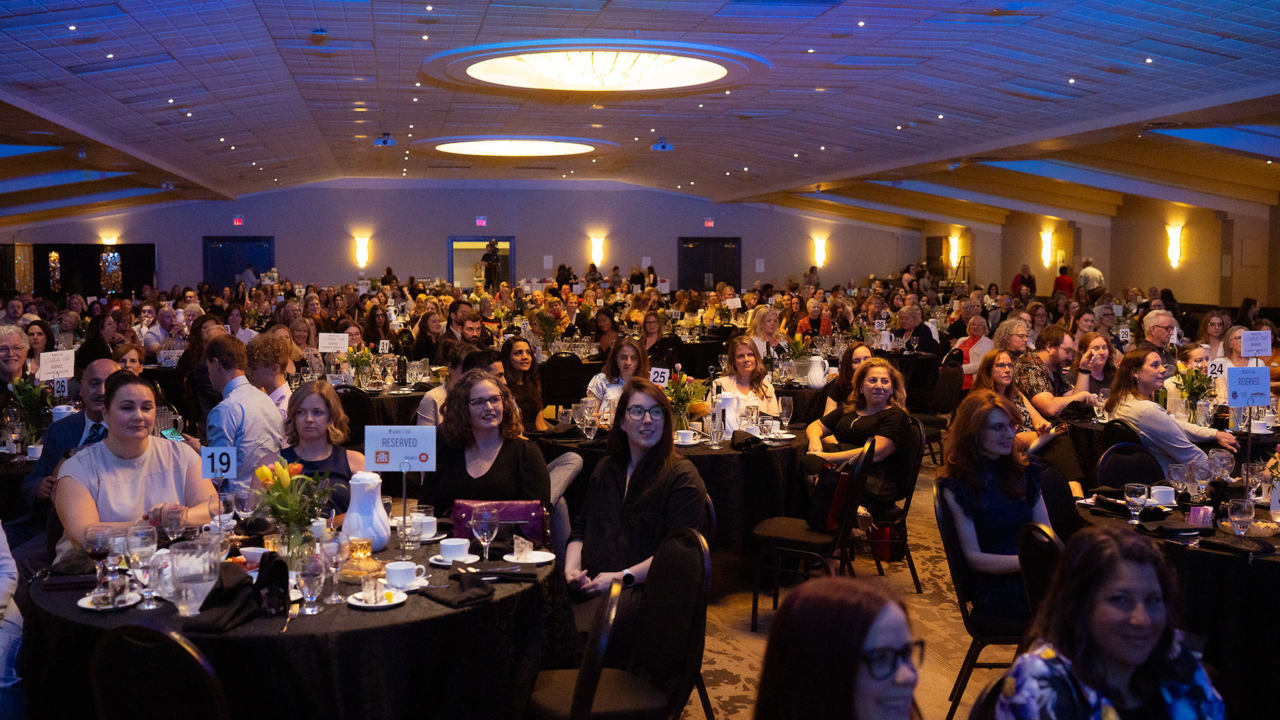 Attendees sitting at tables for the Women of the Year awards