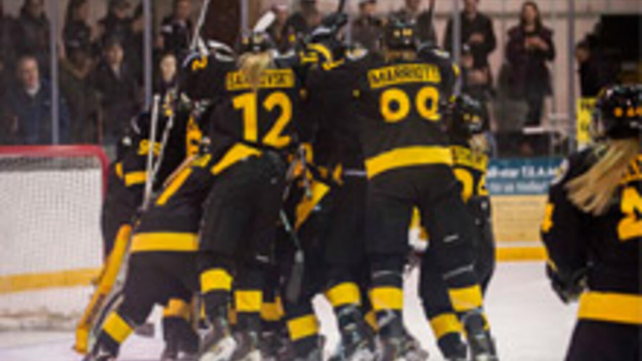 Warriors Women's hockey team celebrating win