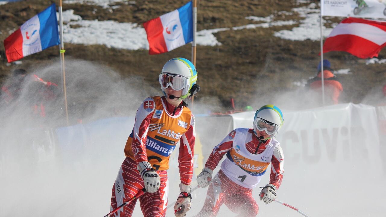 The women's visually impaired Super-G event at the 2013 IPC Alpine World Championships in La Molina, Spain. Henrieta Farkasova and guide Natalia Subtrova. Photo by: LauraHale,  Creative Commons Attribution-Share Alike 3.0 Unported.