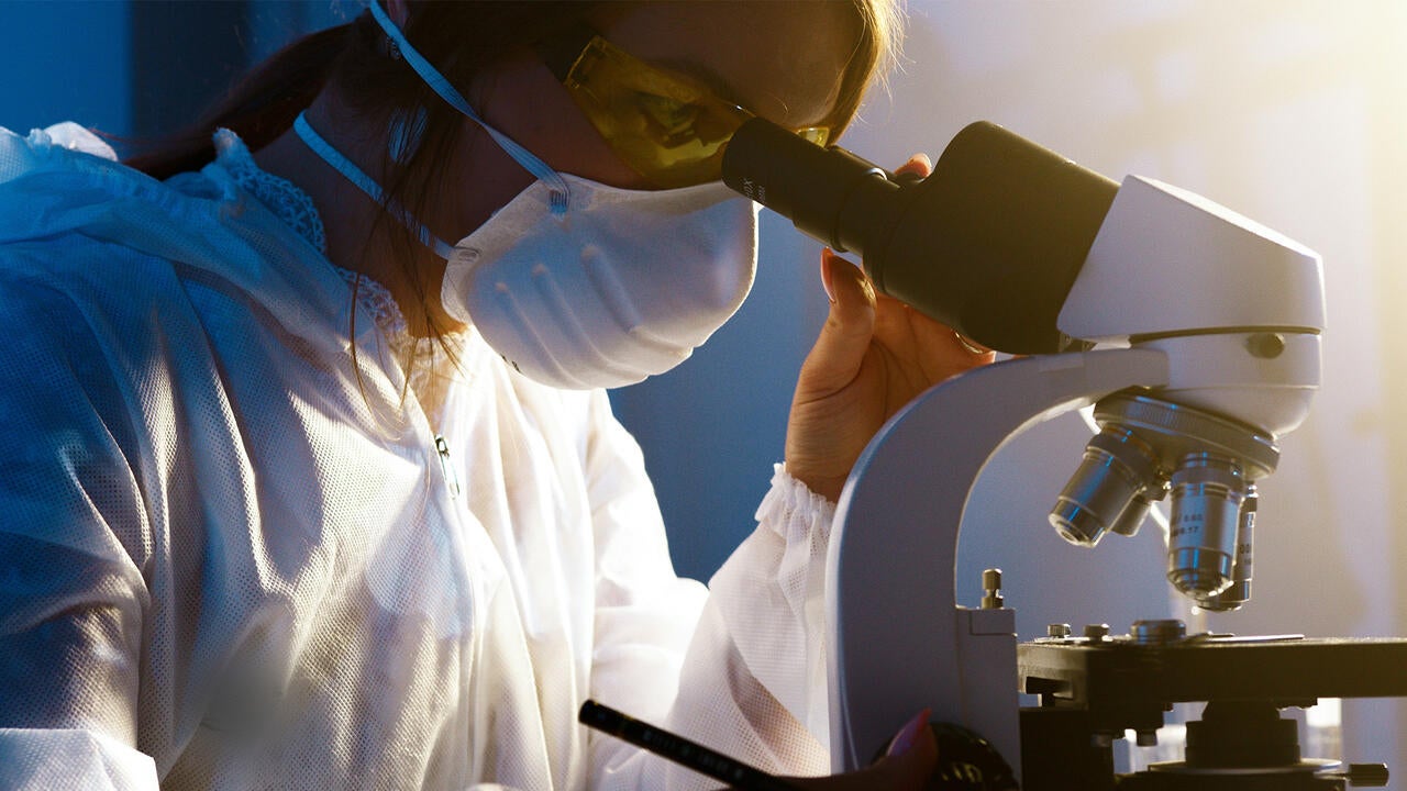 Girl looking in microscope 