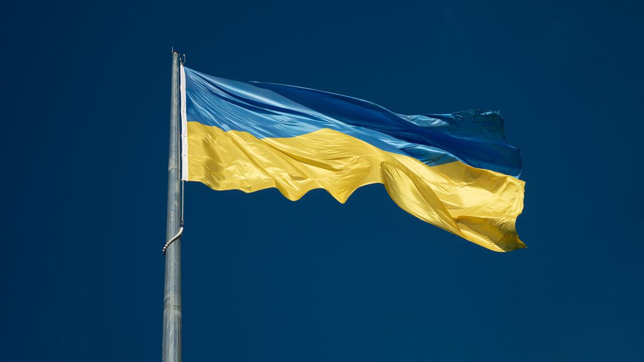 a ukrainian flag waving in the wind