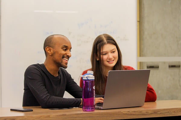Nain Abdi showing a friend the Colare assessment process