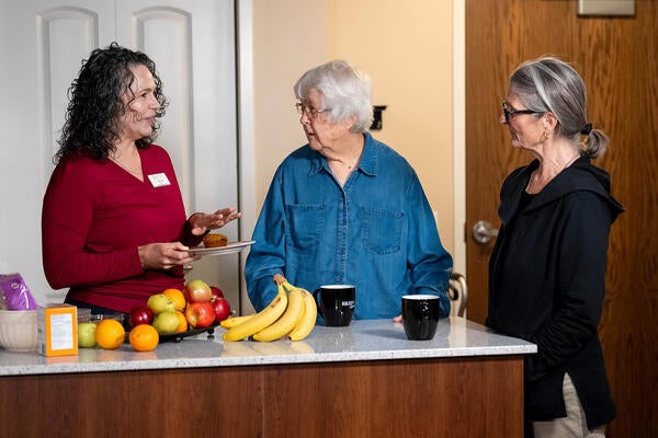 Heather Keller chats about calories while holding a muffin