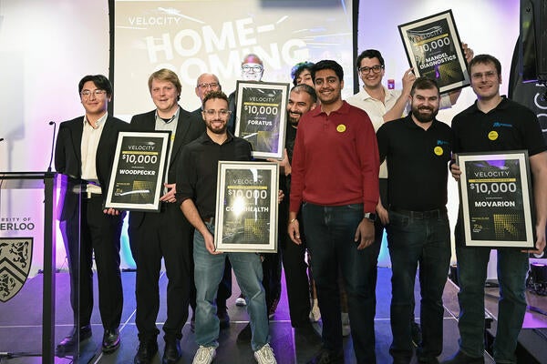 2025 Momentum Grant winners pose for group photo on stage at Velocity Homecoming