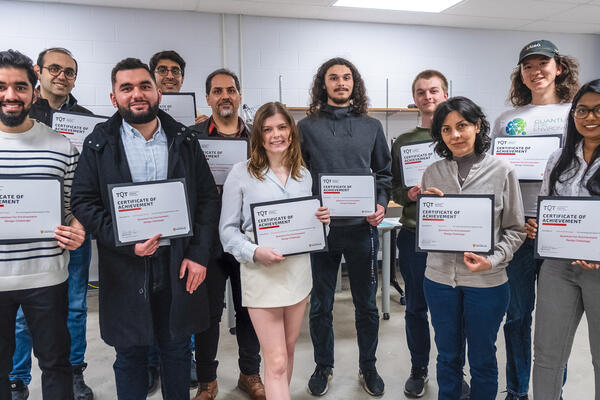 Waterloo graduate students and postdoctoral fellows accept their awards for Quantum for Environment Design Challenge