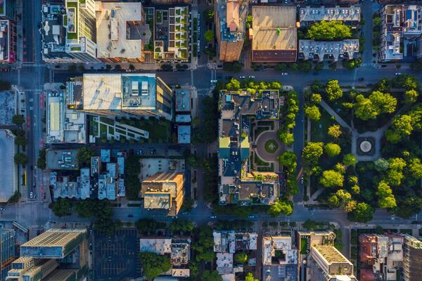 Top-down view of an urban neighbourhood with high- and low-rise buildings and green space