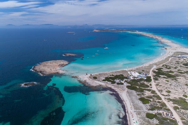 Stock image of blue ocean with land on the right