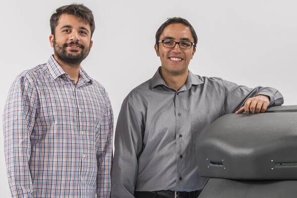 Avidbots founders Pablo Molina and Faizan Sheikh beside Neo