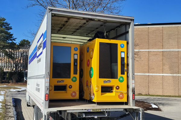 Vending machines containing m&m candies and pin-hole cameras are loaded in the back of a moving truck removed from UWaterloo