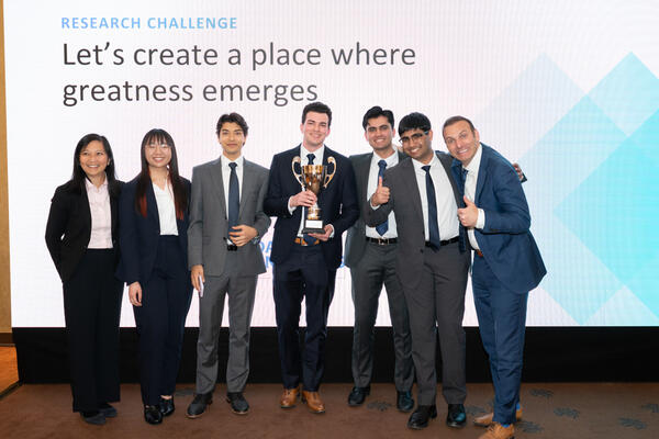 Waterloo students at the CFA Institute's Research Challenge in Poland holding their award
