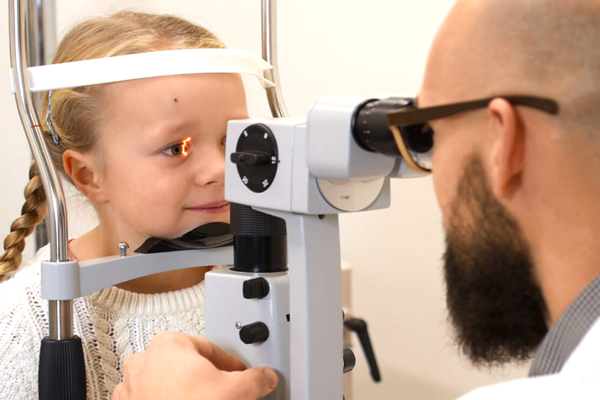 A child's eyes being examined 