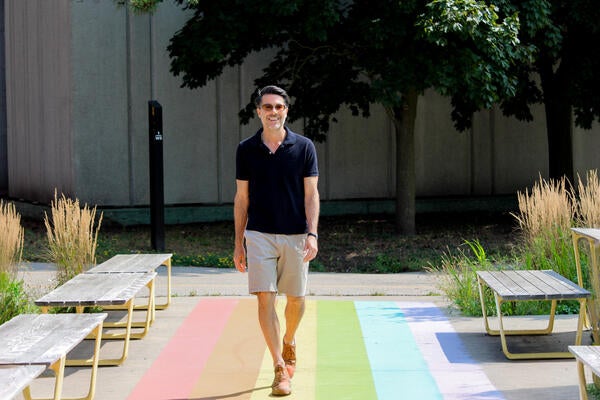 Dr. Brian Oren walks down a path at the University of Waterloo 