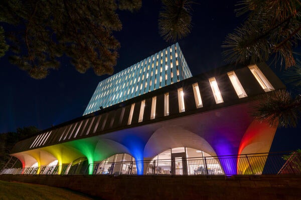 Dana Porter Library illuminated with pride lighting at night