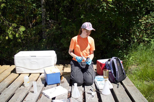 Ellen Cameron collecting water samples