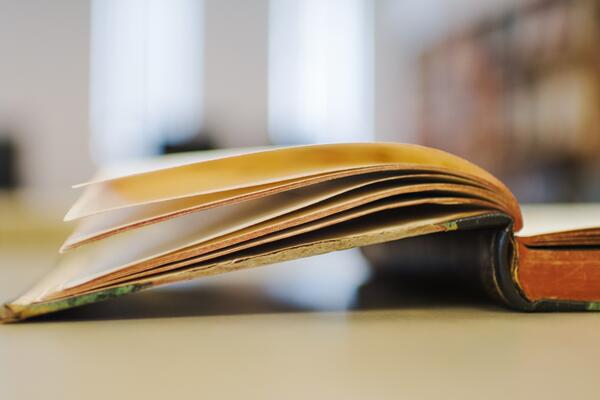 Book from the archives lies open on a table