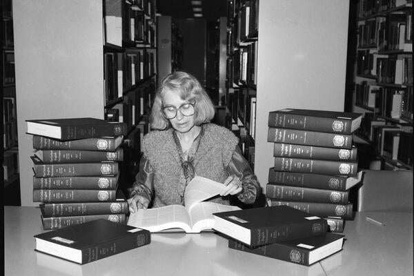 Woman reading Oxford English Dictionary
