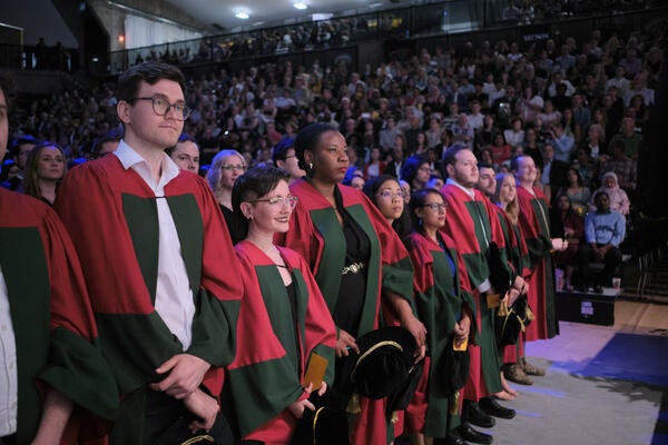 Group of PhD graduates in the front row of convocation hall