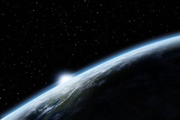 Earth in space showing sunrise