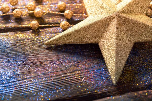 star decoration and garland covered in glitter