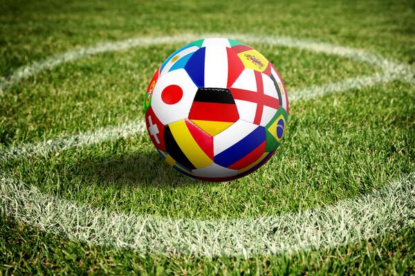 Soccer ball on green playground