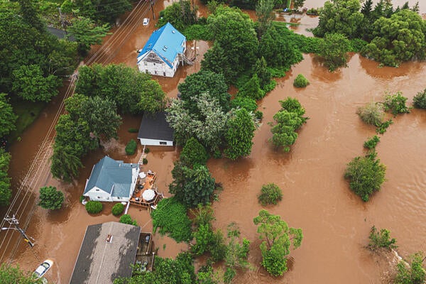 Aerial view of a flooding with houses and trees surrounded by water