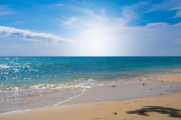 Sparkling sea water contrast with the blue sky