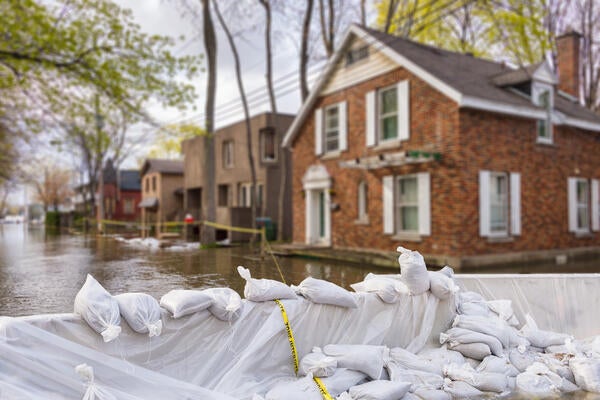Extreme flooding in a neighborhood with sandbags used as blockage 