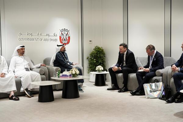 Mark Schaan seated with AI Minister, the Honourable Evan Solomon, in October 2025 with delegates from Abu Dhabi